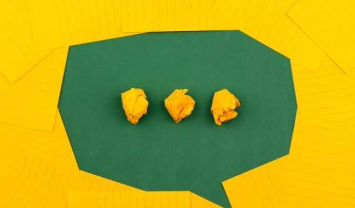 Suggestion box concept with a speech bubble and notes, symbolising public ideas and feedback